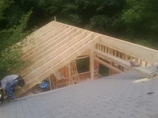 Framing a new roof addition that ties into an existing shingle roof in Wayland